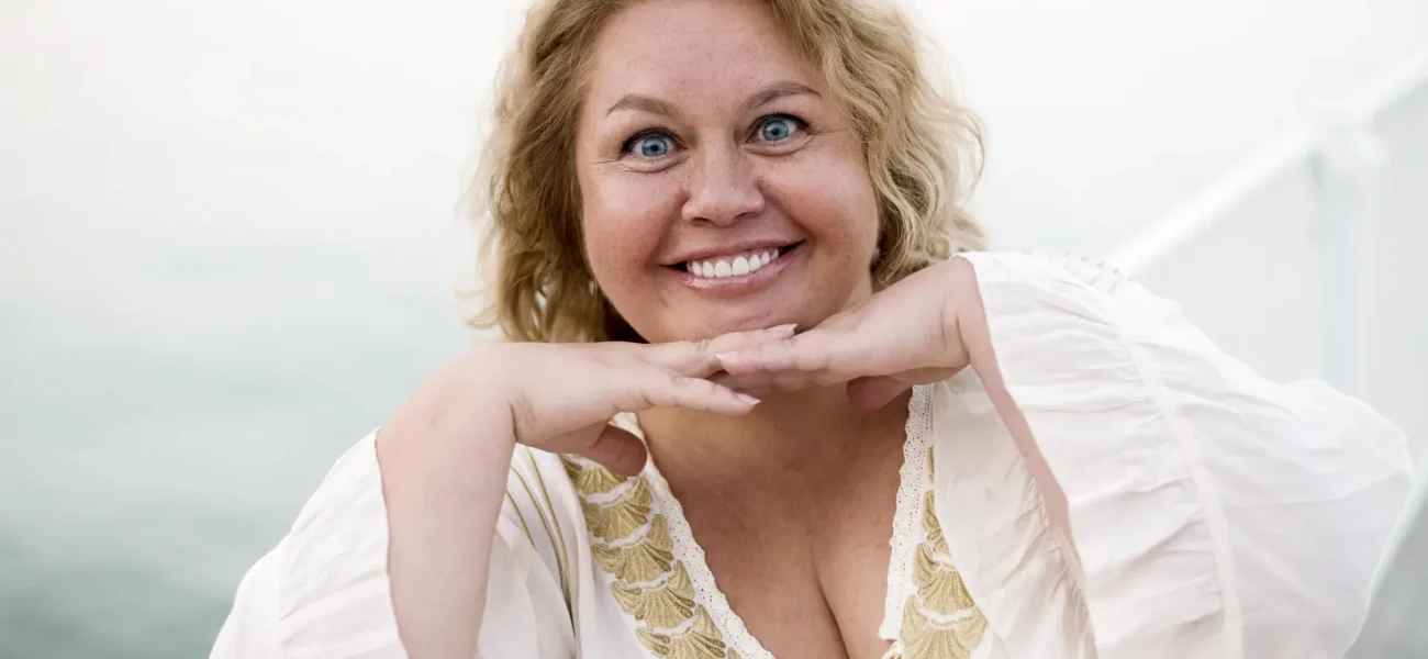 plus-size-model-smiling-holding-her-head-with-hands(2)